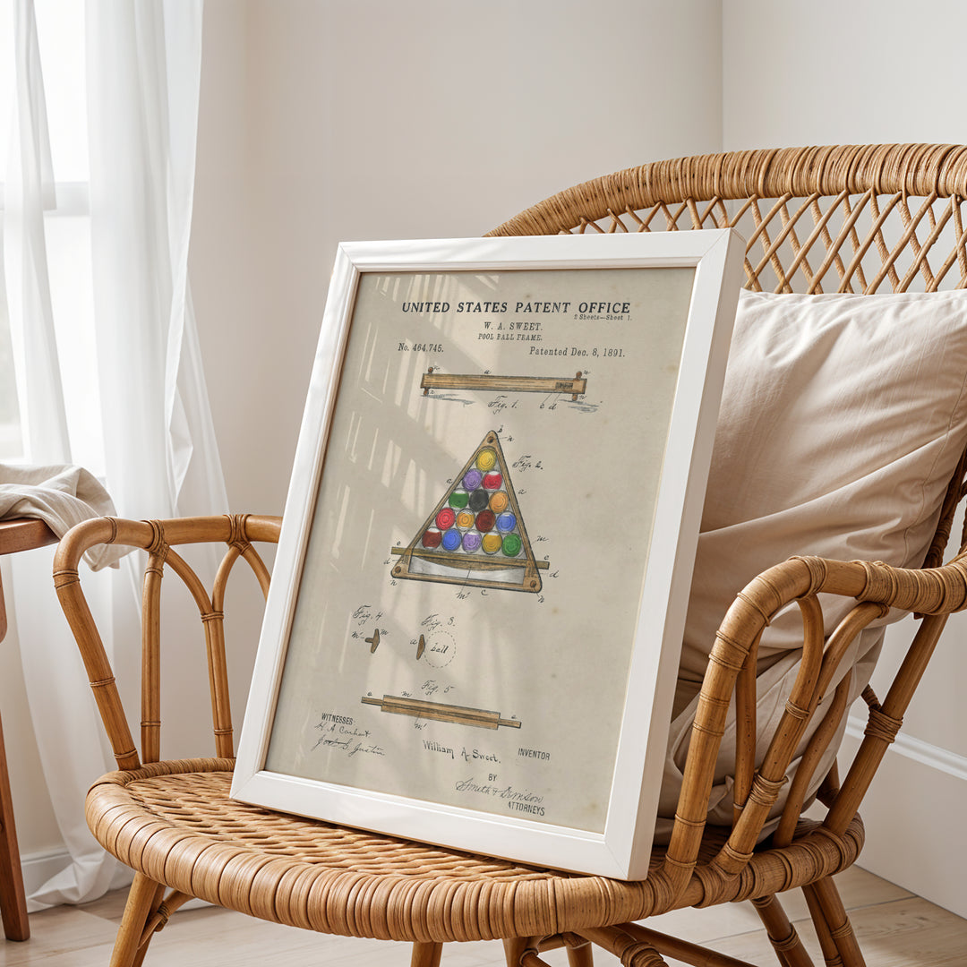 a wicker chair with a framed picture of a pyramid