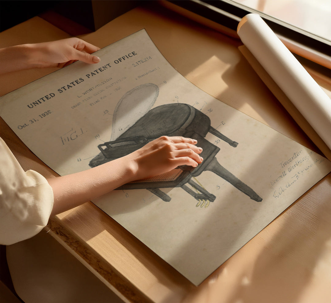 a person holding a piece of paper on top of a table