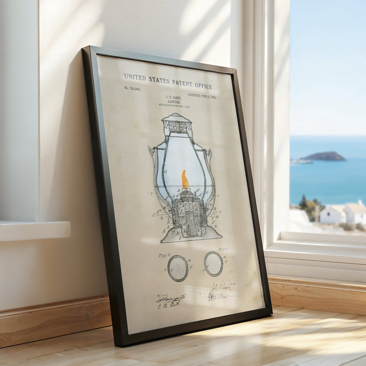 a framed drawing of a lantern on a window sill