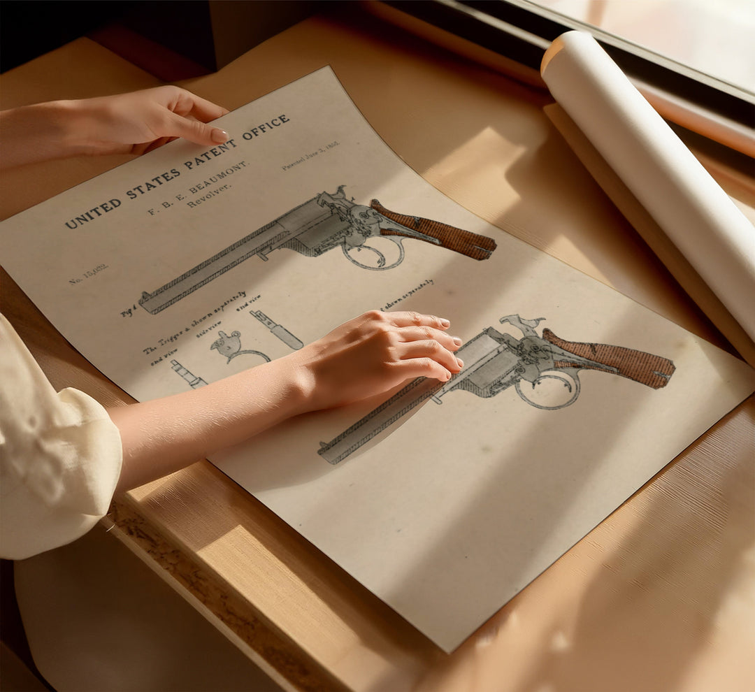 a person holding a gun on top of a piece of paper