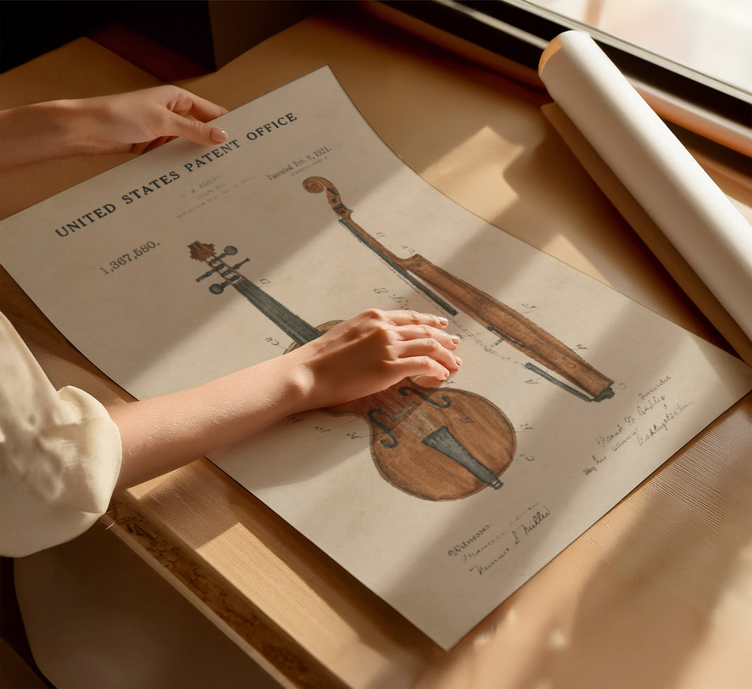 a person holding a sheet of paper with a violin on it