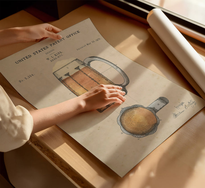 a person holding a piece of paper on top of a table