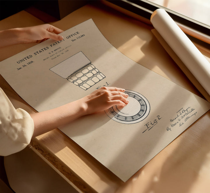 a person's hand on top of a piece of paper