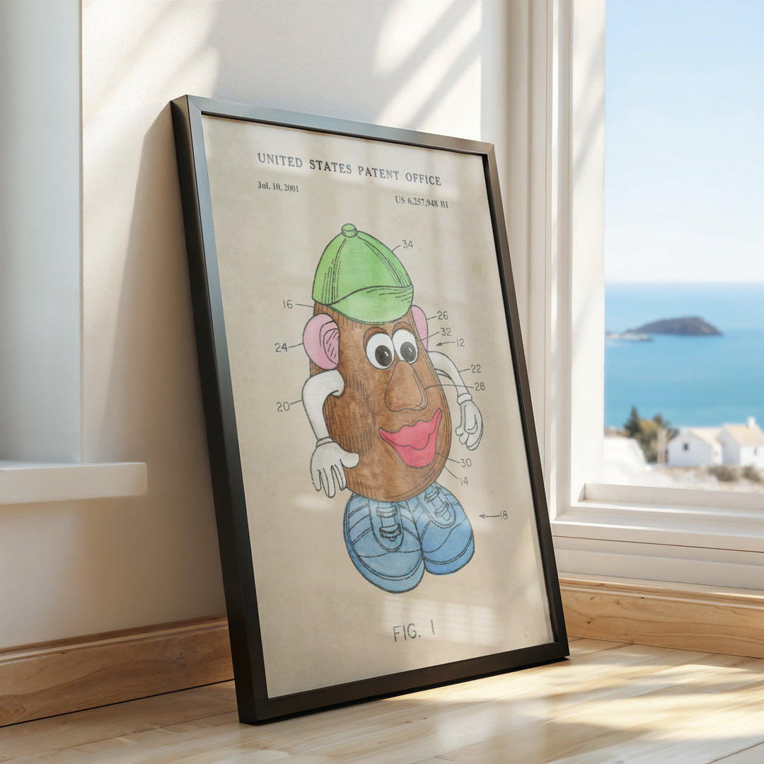 a framed picture of a cartoon character on a window sill