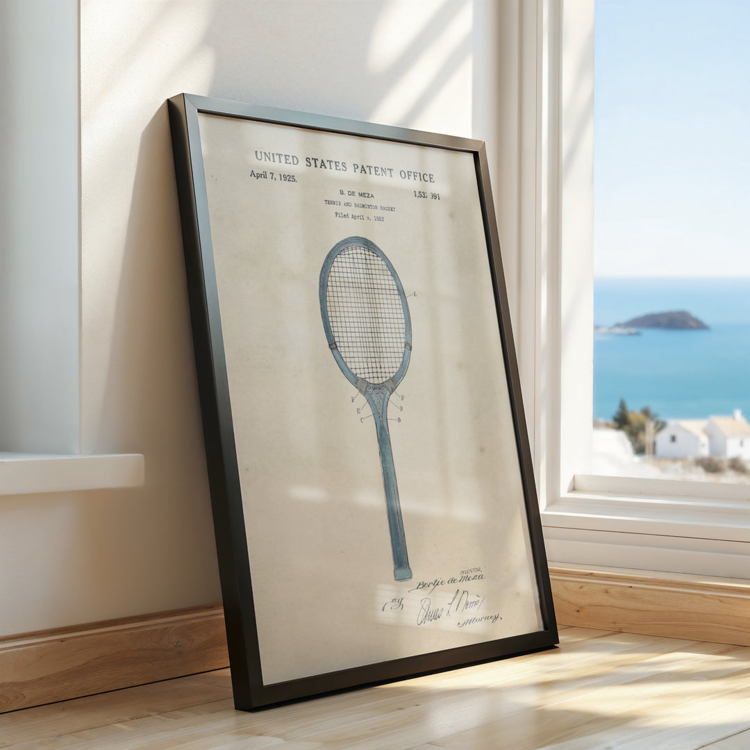 a framed picture of a tennis racket on a window sill