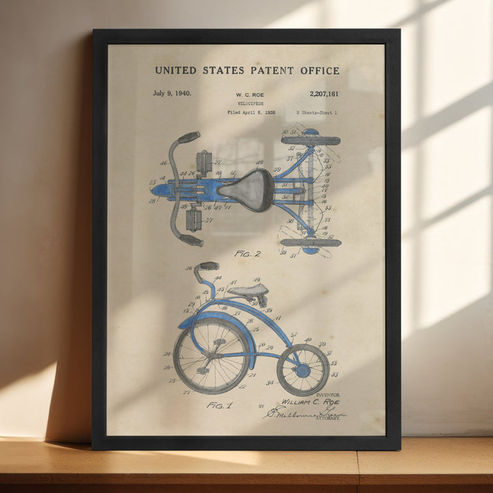 a framed blueprint of a bicycle on a shelf