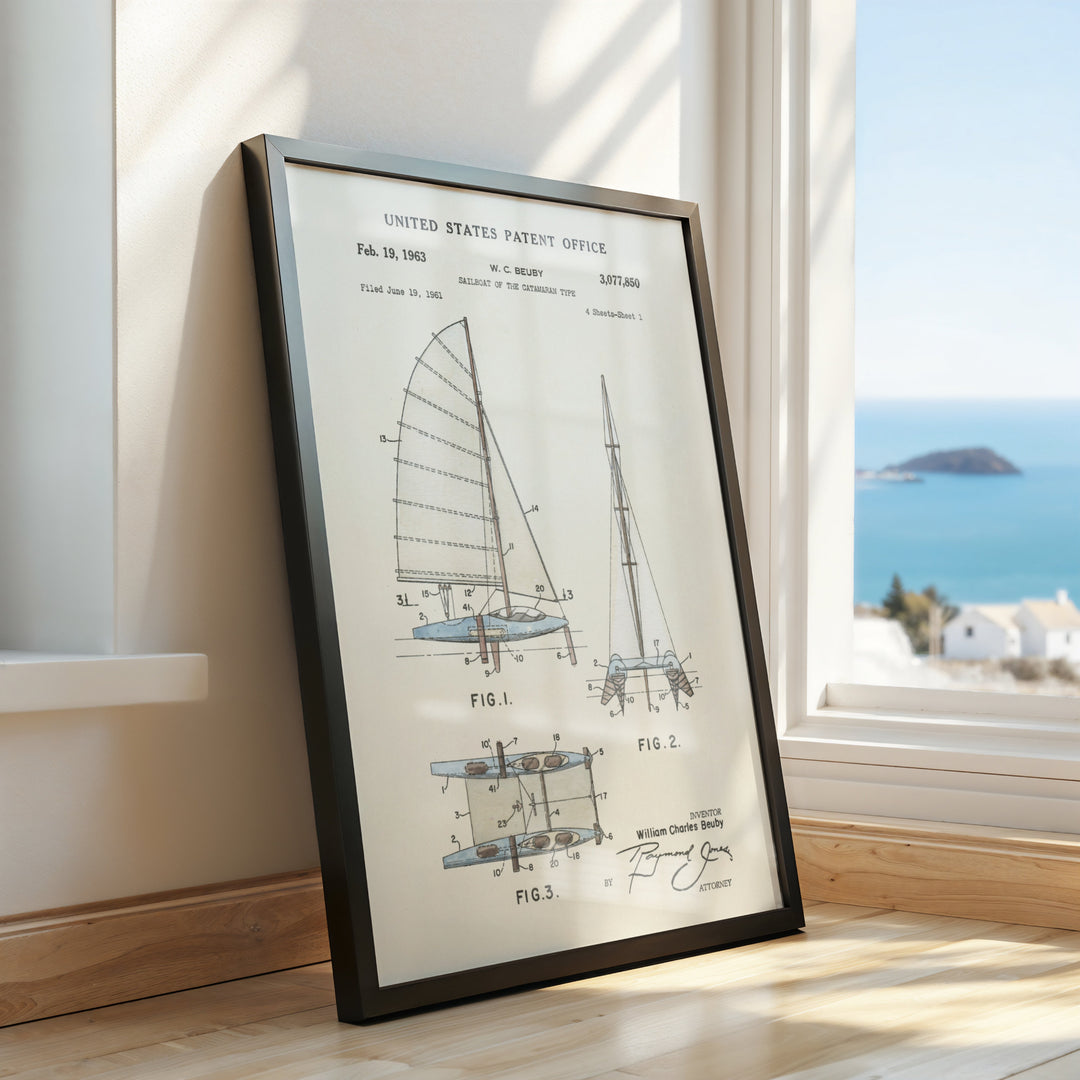 a framed picture of a sailboat on a window sill