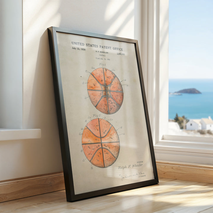 a framed picture of three oranges on a window sill