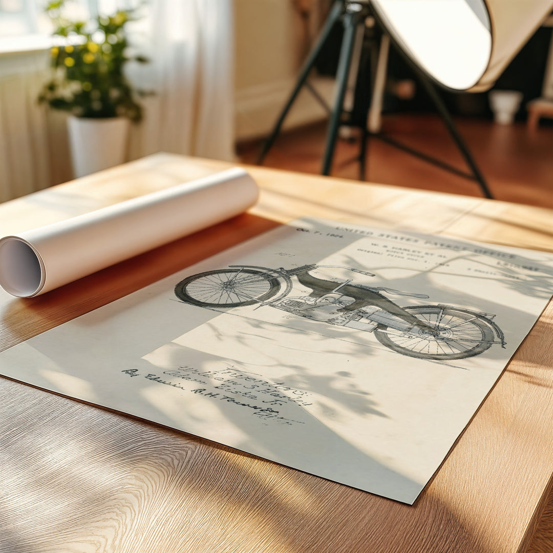 a picture of a bicycle on a table next to a roll of paper