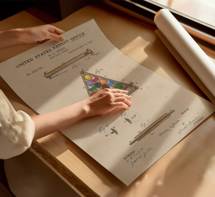 a person holding a piece of paper on top of a table