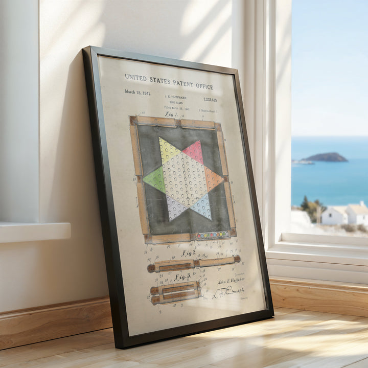 a framed picture of a quilt on a window sill