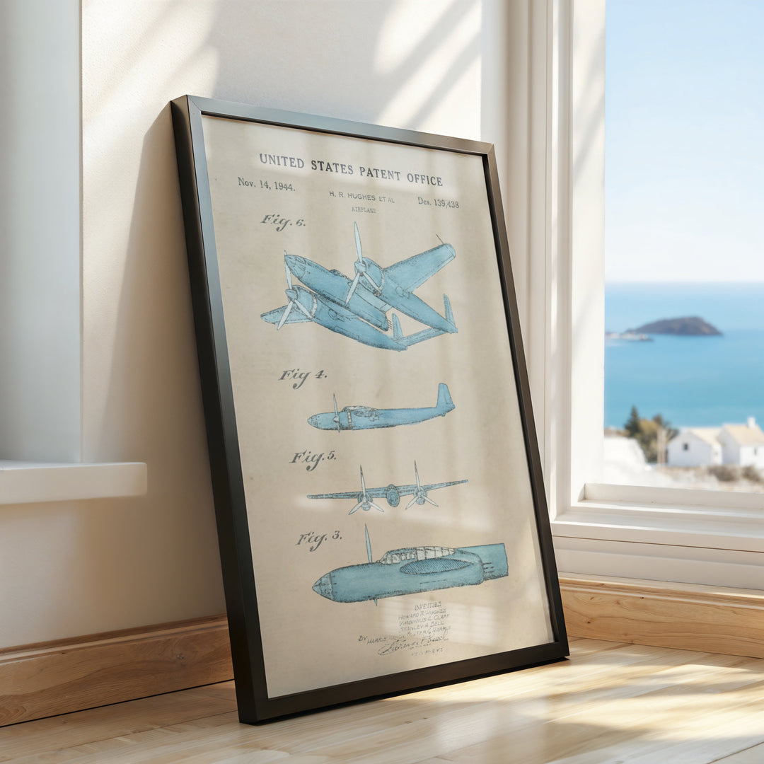 a framed picture of a plane on a window sill