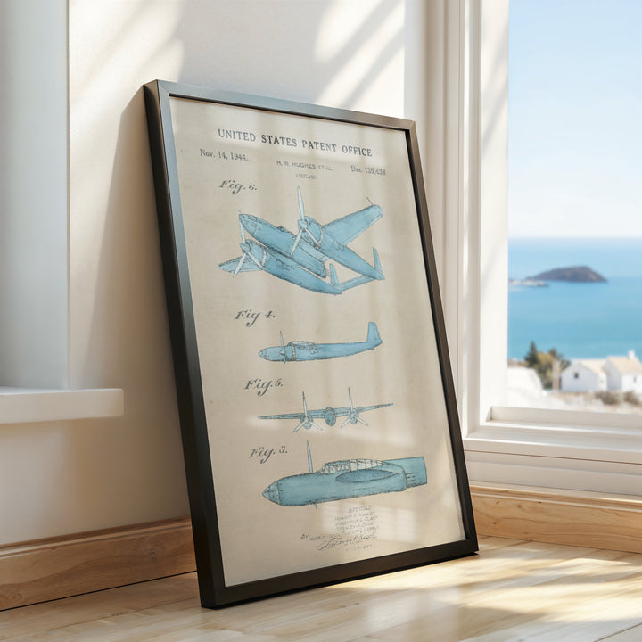 a framed picture of a plane on a window sill