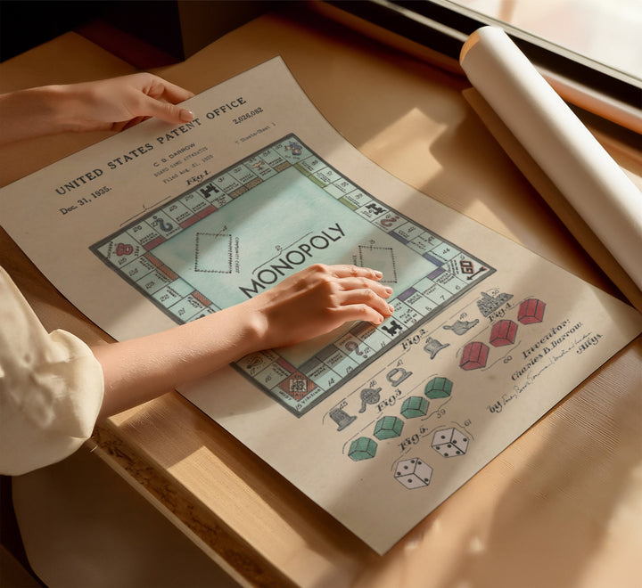 a person playing a game of monopoly on a table