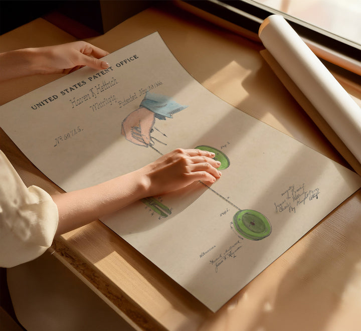 a person's hand on top of a piece of paper