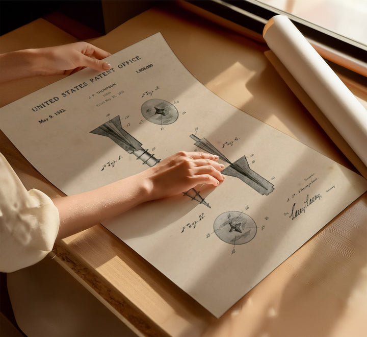 a woman's hand on top of a sheet of paper