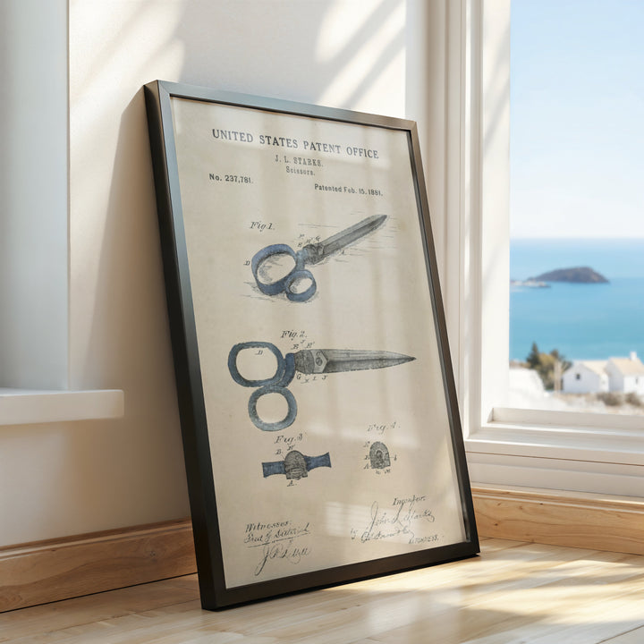 a framed picture of a pair of scissors