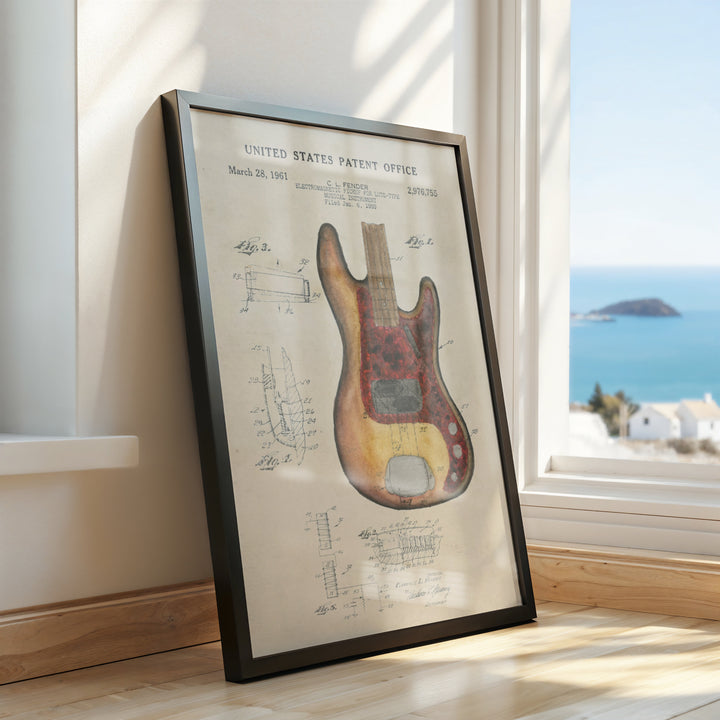 a picture of a guitar in a frame on a window sill