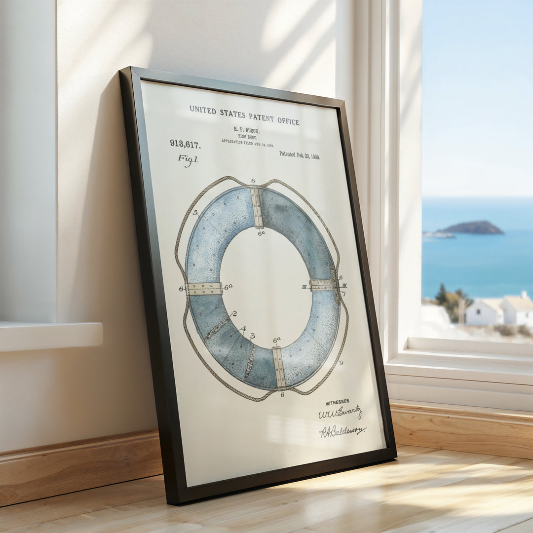 a framed picture of a life preserver on a window sill