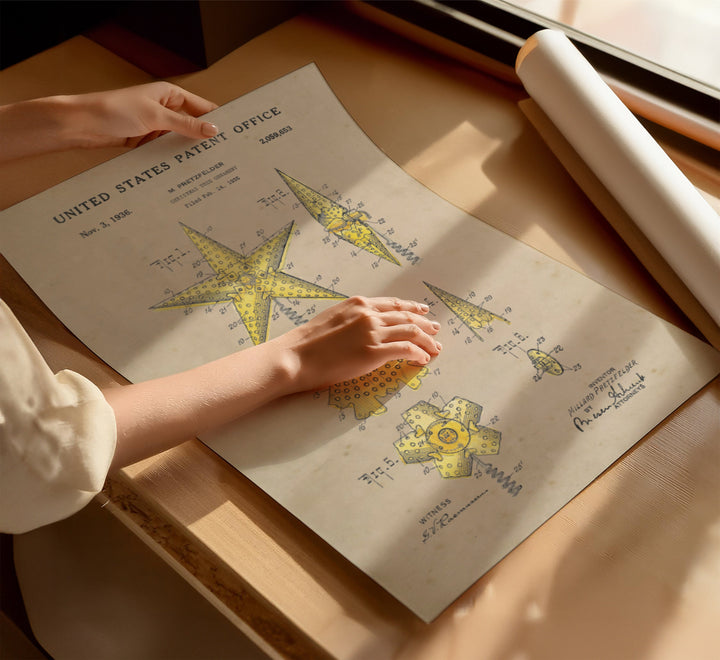 a person's hand on top of a sheet of paper