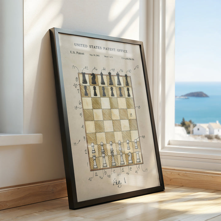 a framed picture of a chess board in front of a window