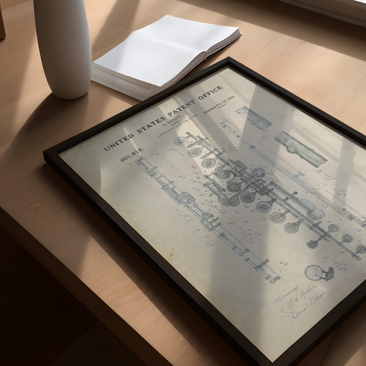 a picture frame sitting on top of a table next to a vase