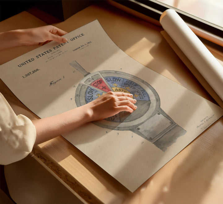 a person holding a piece of paper on top of a table