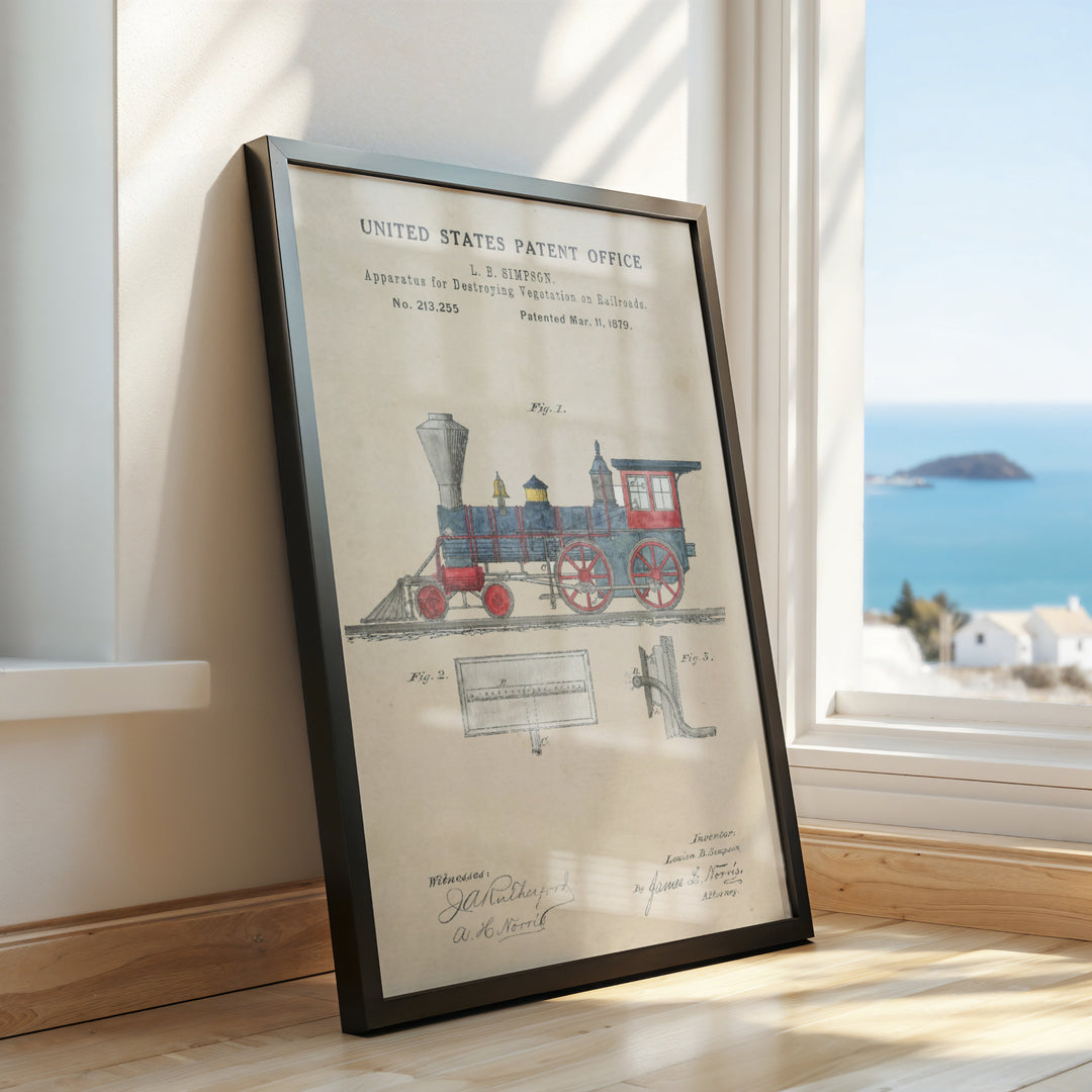 a framed picture of a train on a window sill