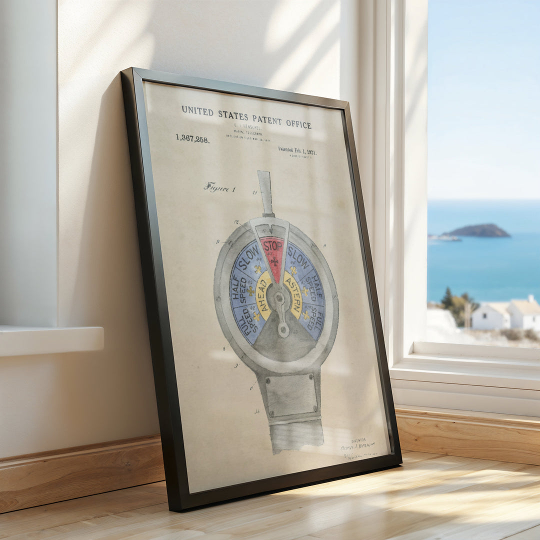 a framed picture of a watch on a window sill