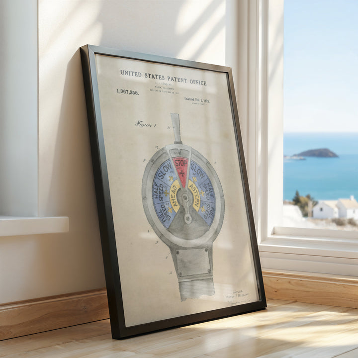 a framed picture of a watch on a window sill