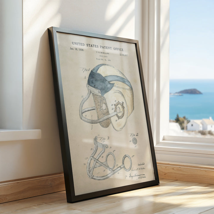 a framed drawing of a football helmet on a window sill