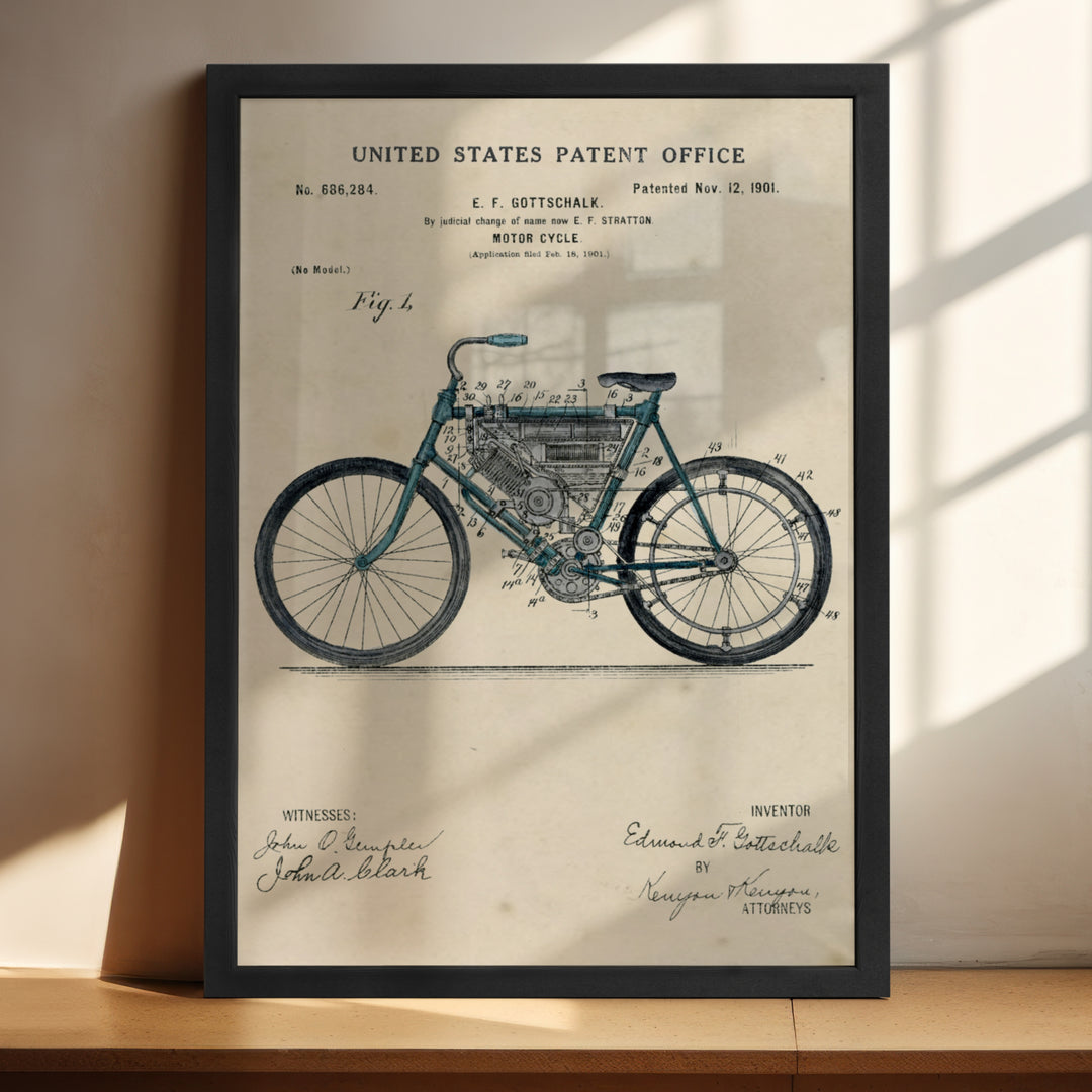 a framed picture of a bicycle on a shelf