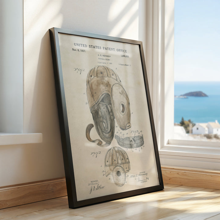 a framed drawing of a helmet on a window sill