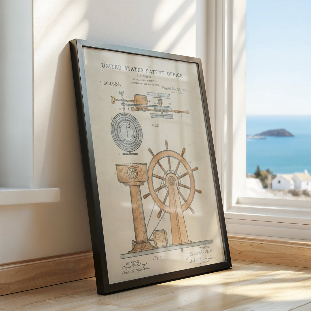 a framed poster of a spinning wheel on a window sill