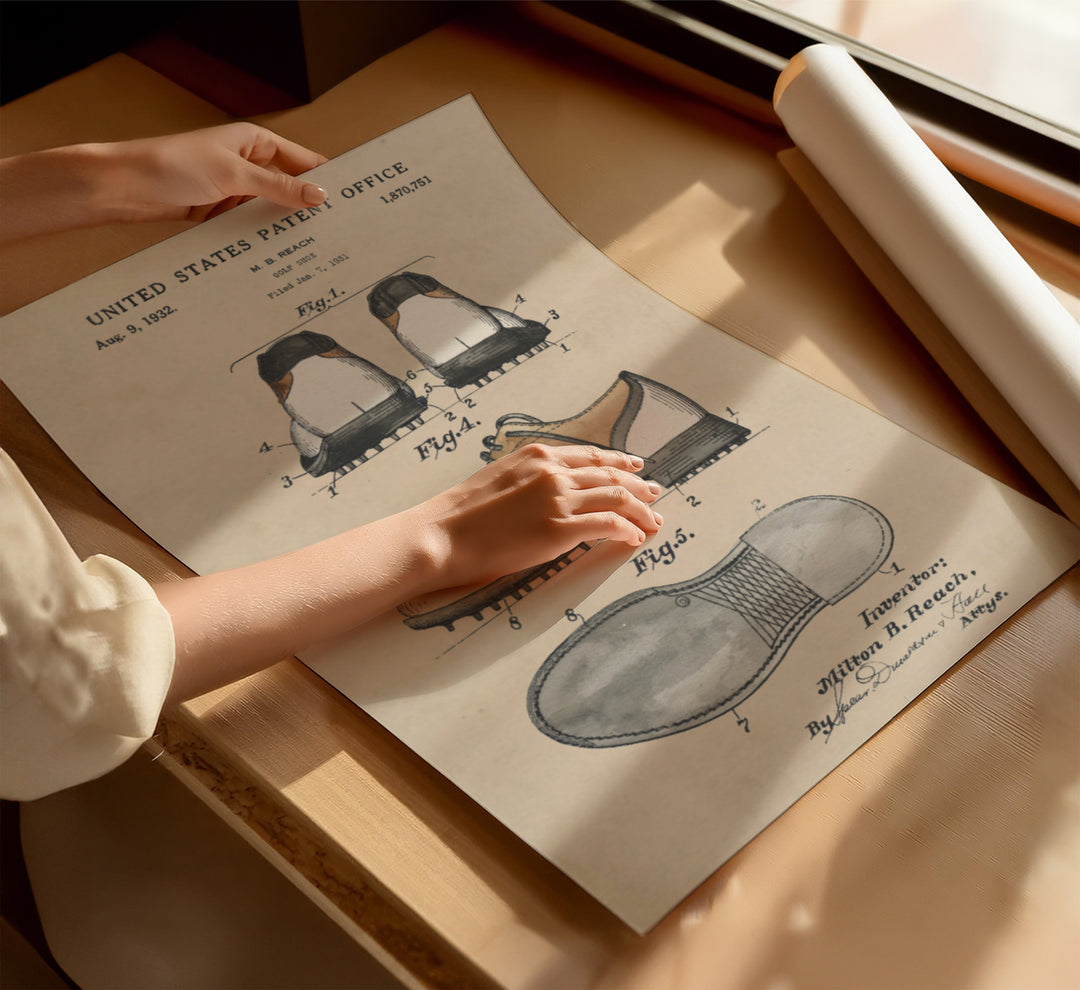 a woman's hand on a piece of paper next to a pair of shoes